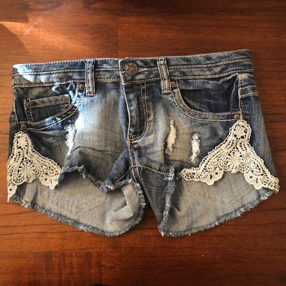 Denim shorts with lace on sides